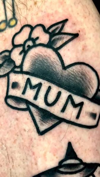 Traditional heart banner tattoo by @edstaplestattooer