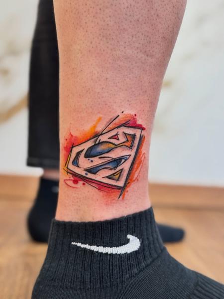 Illustrative superman logo tattoo by @tease_84