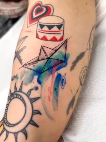 Illustrative paper boat tattoo by @tease_84