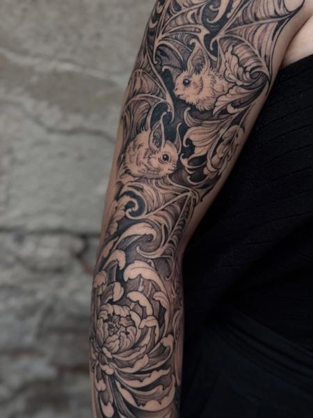 Blackwork bats and flowers tattoo by @elapour