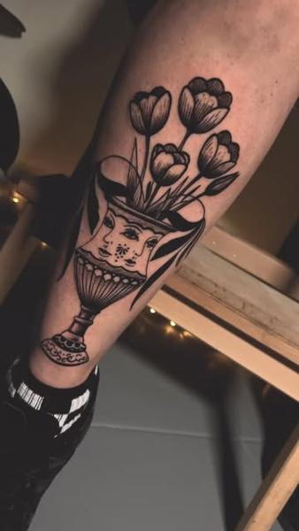 Traditional floral vase tattoo by @jelene_tattoo