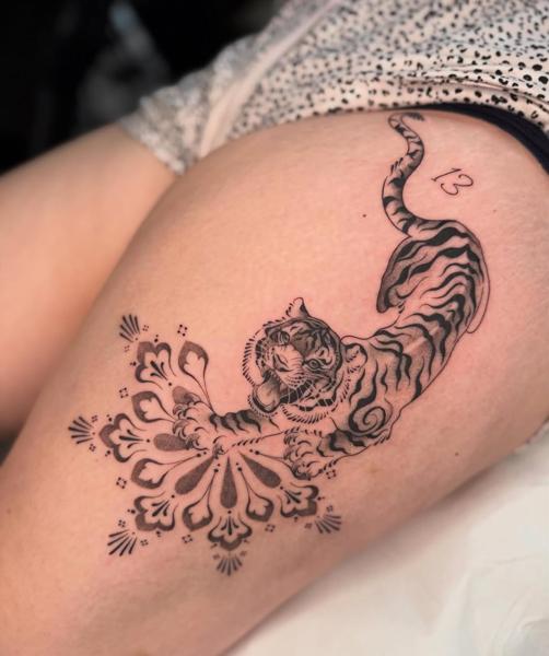 Illustrative blackwork ornamental tiger tattoo by @bethcribbintattoo