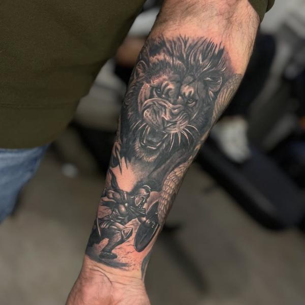 Realism lion and warrior tattoo by @ellecartelle