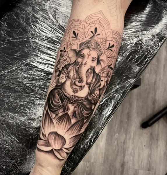 Realism ganesha tattoo by @elle_ink_