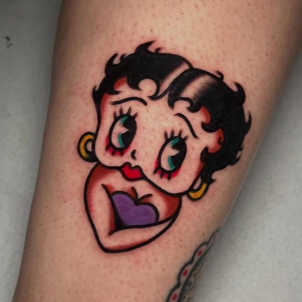 Traditional cartoon character tattoo by @ellie_tattooer