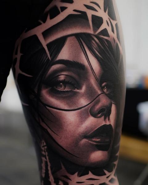 Realism thorned woman tattoo by @ellietaylor.tattoos