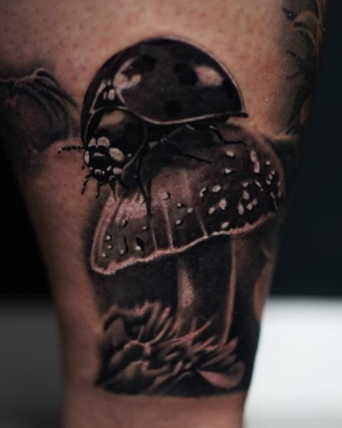 Realism ladybug mushroom tattoo by @ellietaylor.tattoos