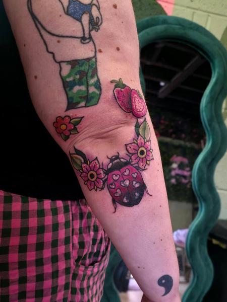 Traditional floral ladybug tattoo by @emmaelizabethtattoo