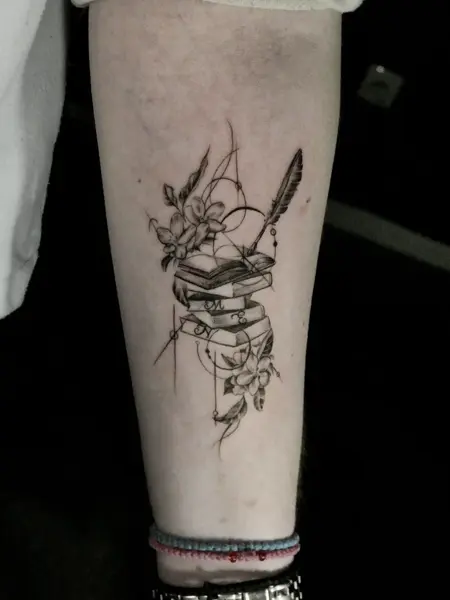 Fine line floral books tattoo by @endrilazaj