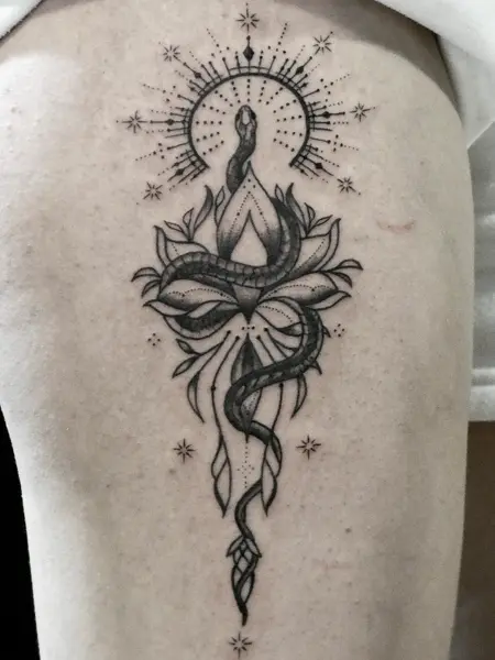Blackwork snake and lotus tattoo by @endrilazaj