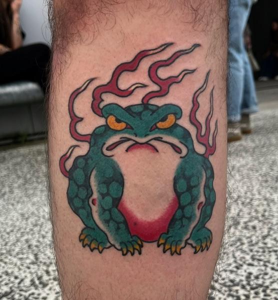 Traditional flaming toad tattoo by @erik_van_cuyck