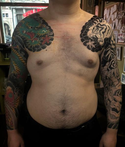 Japanese dragon and tiger tattoo by @erik_van_cuyck