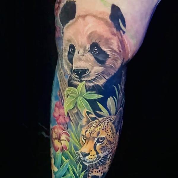 Realism panda and leopard tattoo by @erinjadetattoos