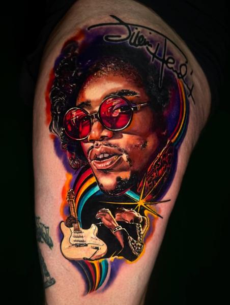 Realism musician portrait tattoo by @eireink