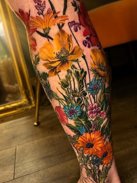 Realism floral bouquet tattoo by @eireink
