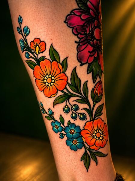 Traditional colorful flowers tattoo by @eireink
