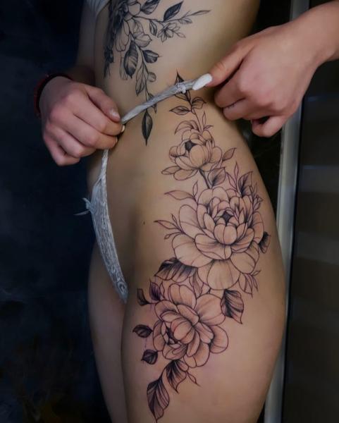 Fine line floral design tattoo by @erlindi_tattoo