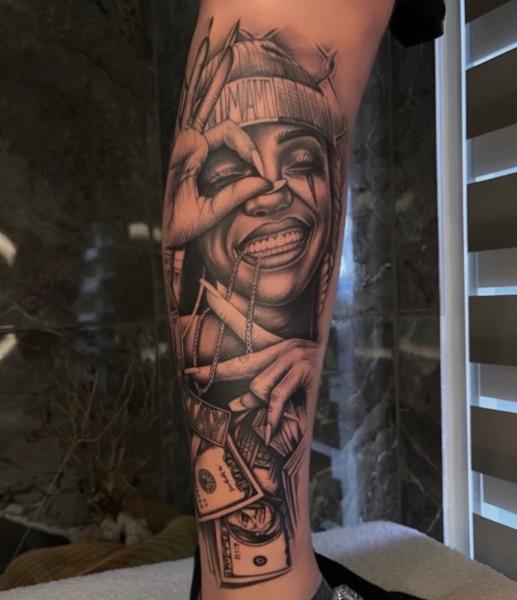 Realism smiling woman tattoo by @erlindi_tattoo