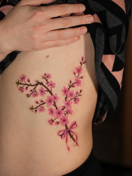 Illustrative cherry blossom branch tattoo by @estertarabal