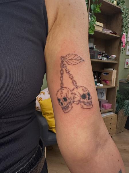 Fine line skull earrings tattoo by @moonchild_finetattoo