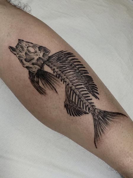 Blackwork fish skeleton tattoo by @mo.rf_tattoo
