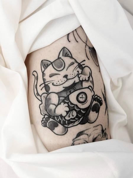 Traditional lucky cat tattoo by @evanthiee