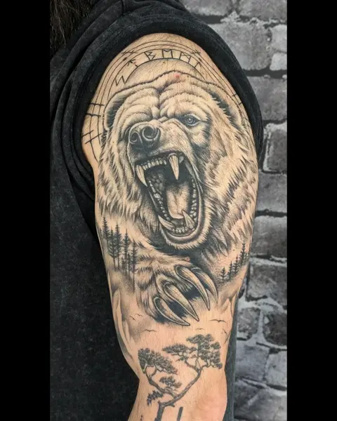 Realism roaring bear tattoo by @evi.sv