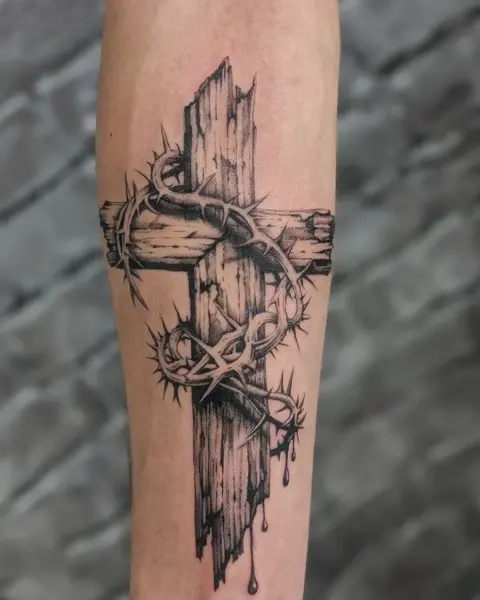 Realism cross with thorns tattoo by @evi.sv