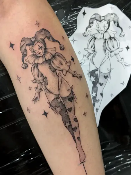 Illustrative jester character tattoo by @evi.sv