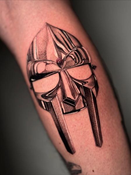 Illustrative mf doom mask tattoo by @corvus_ntc
