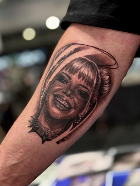Realism smiling portrait tattoo by @fabio.ricchio