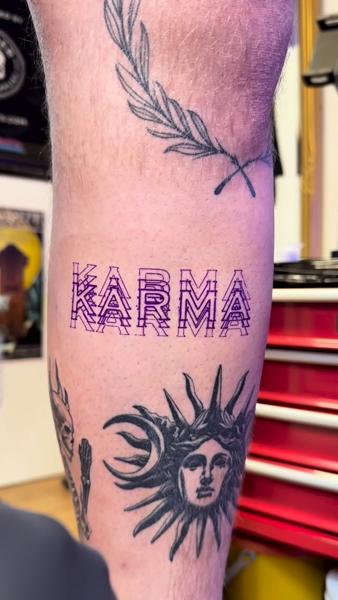 Linework karma text tattoo by @fabio.ricchio