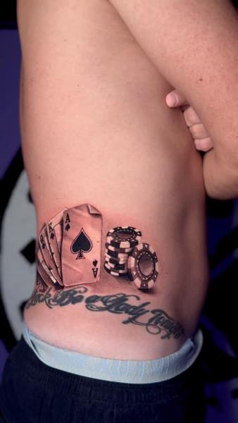 Realism playing cards tattoo by @fabio.ricchio