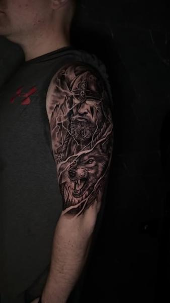 Realism viking and wolf tattoo by @GiafkaTattoo33