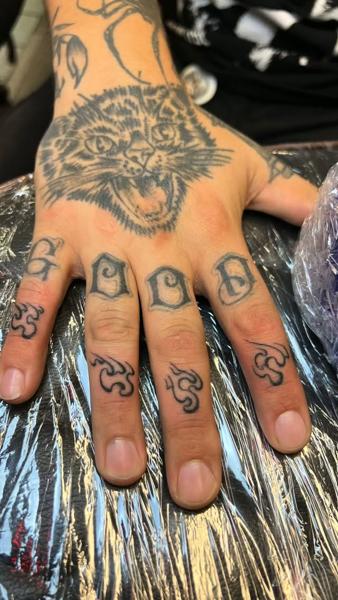 Traditional cat and lettering tattoo by @fatboy_tattoos