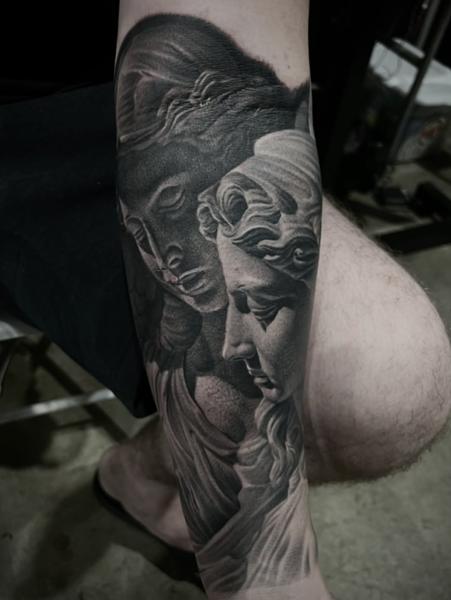 Realism angel statues tattoo by @fatboy_tattoos