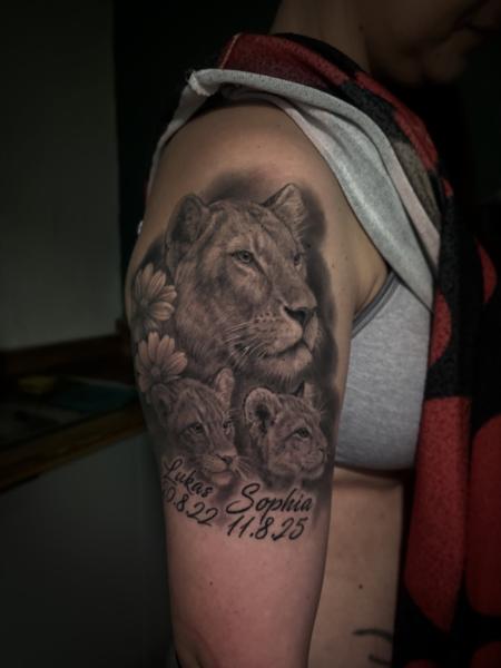 Realism lion family tattoo by @flozimmerertattoo