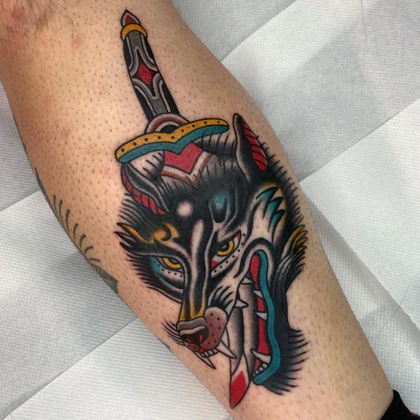 Traditional wolf and dagger tattoo by @fontascast