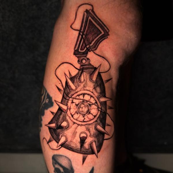 Illustrative spiked grenade tattoo by @void96_tattoo