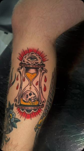 Traditional hourglass skull tattoo by @gardner_ink