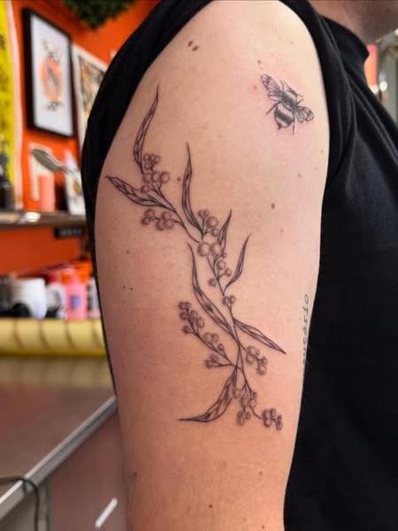 Fine line floral branch tattoo by @gayle.inklore