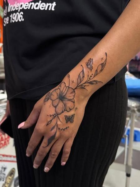 Fine line floral butterfly tattoo by @gayle.inklore
