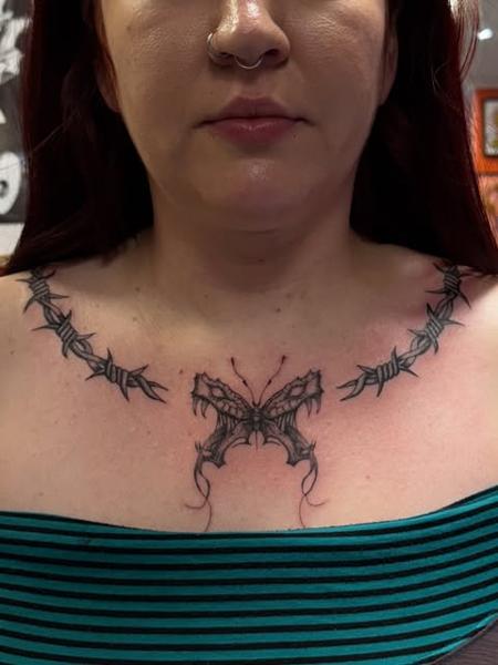 Blackwork barbed wire butterfly tattoo by @gayle.inklore