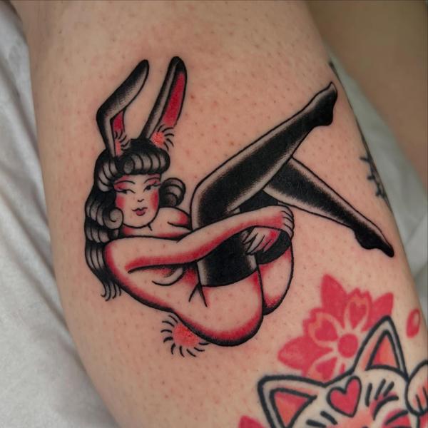 Traditional pin-up bunny tattoo by @geeetattoos