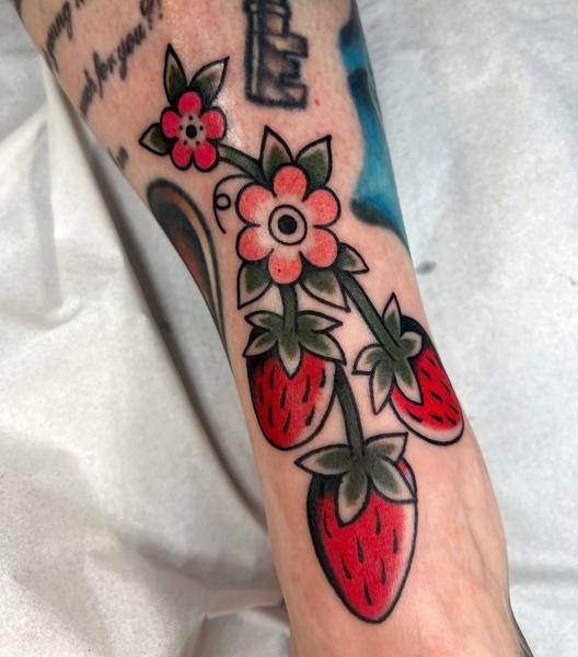 Traditional strawberry flowers tattoo by @geeetattoos