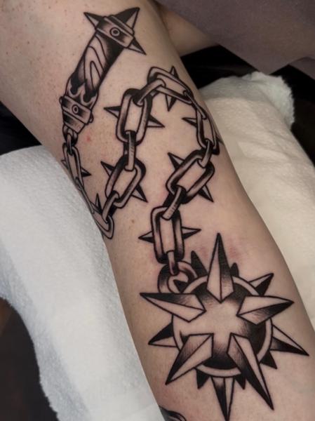 Blackwork spiked chain tattoo by @geeetattoos