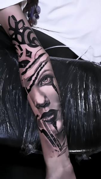 Realism abstract face tattoo by @daskgeorge