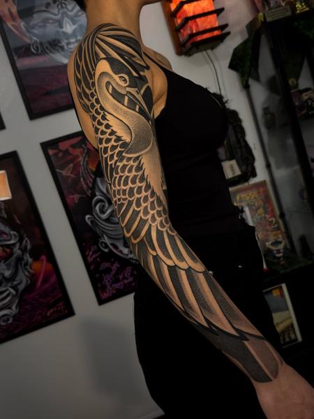 Blackwork geometric swan tattoo by @taish.one