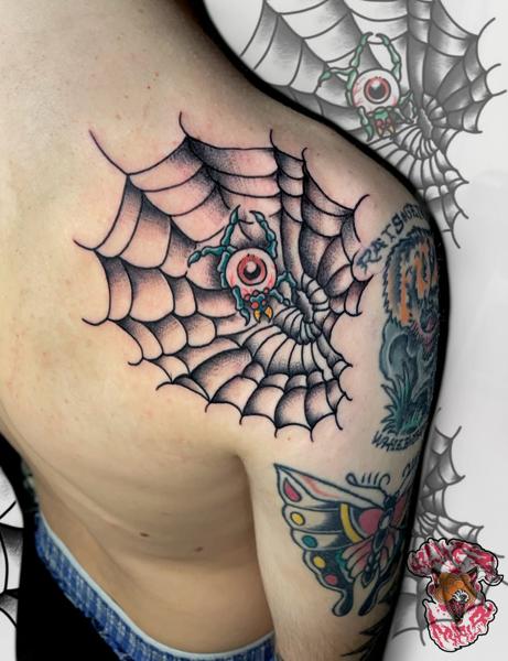 Traditional eyeball spiderweb tattoo by @alma_mala_tattoo