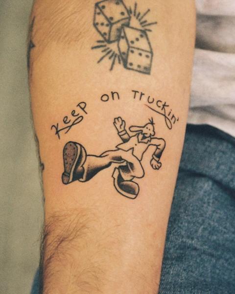 Traditional walking character tattoo by @geonik.tattoo